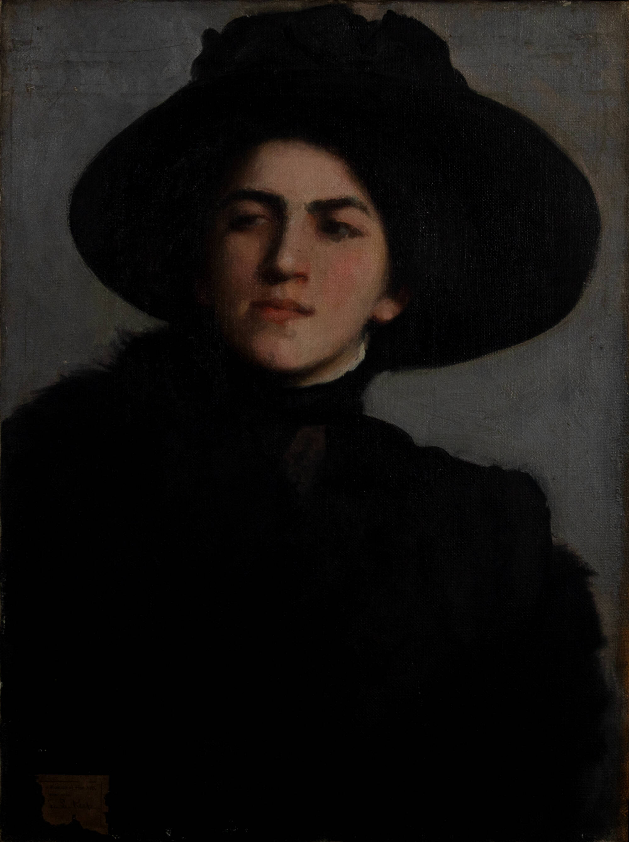 Portrait of a woman wearing black and a large black hat.